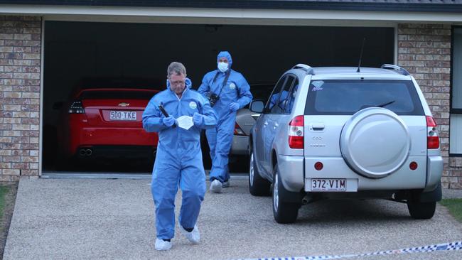 Police in front of an Upper Coomera house where two bodies were found. Picture Glenn Hampson