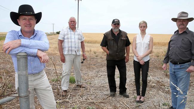 Residents including Will Lee, Steve Martin, Michael Boyd, Eran Boyd, and David Mooresay they don’t want the dam so close to their homes. Picture: Dean Martin