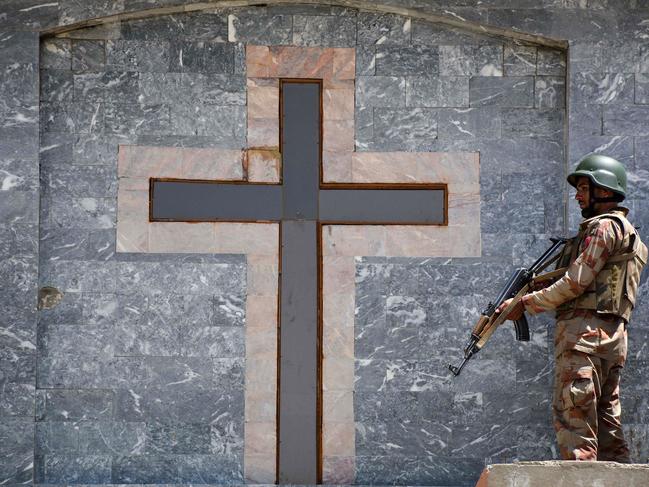 A soldier stands guard on the roof of a Methodist Church during an Easter service in Quetta. Picture: AFP