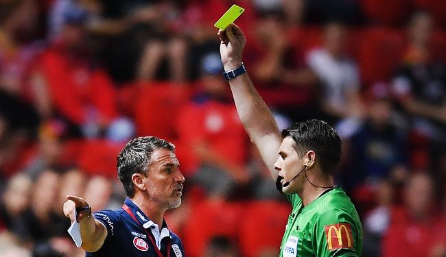 Marco Kurz coach of Adelaide United gets a yellow card from referee Shaun Evans during the round 20 A-League match between Adelaide United and the Central Coast Mariners at Coopers Stadium. Picture: Mark Brake/Getty Images