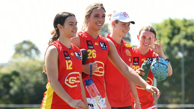 Evy Reeves, Havana Harris and Nyalli Milne of the Suns walk off the field after their victory during the AFL U16 Girls match (Photo by Albert Perez/AFL Photos via Getty Images)