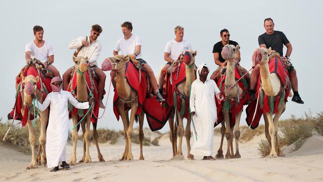 Luke Parker, Dane Rampe, Callum Mills, Isaac Heeney, Josh Kennedy and coach John Longmire on a camel safari in Qatar. Picture: Phil Hillyard