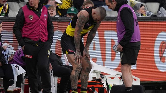 Dustin Martin receives medical attention on his back last weekend. (Photo by Daniel Pockett/Getty Images)