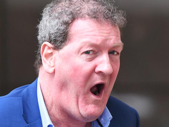 Ricky Nixon arrives at the Melbourne Magistrates Court in Melbourne, Thursday, November 29, 2018. The former AFL footballer appeared in court on traffic related offences. (AAP Image/James Ross) NO ARCHIVING