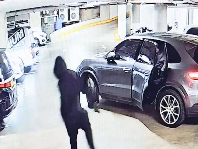 CCTV released by police shows a man with a gun jumping into a car.