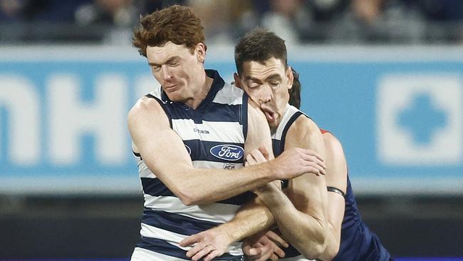 Gary Rohan of the Cats makes accidental contact with Jeremy Cameron of the Cats. (Photo by Daniel Pockett/Getty Images)