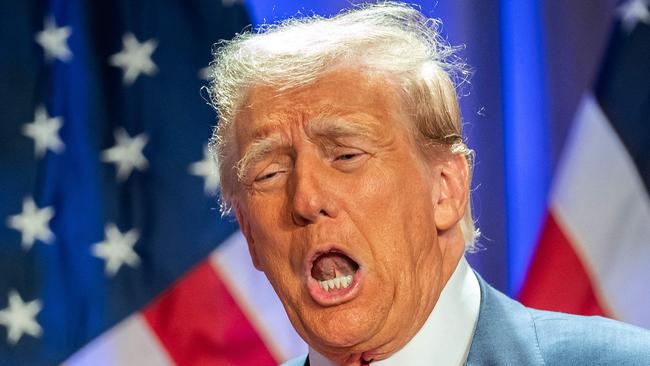 US President-elect Donald Trump gestures as he attends a meeting with House Republicans at the Hyatt Regency hotel in Washington, DC on November 13, 2024. (Photo by Allison ROBBERT / AFP)