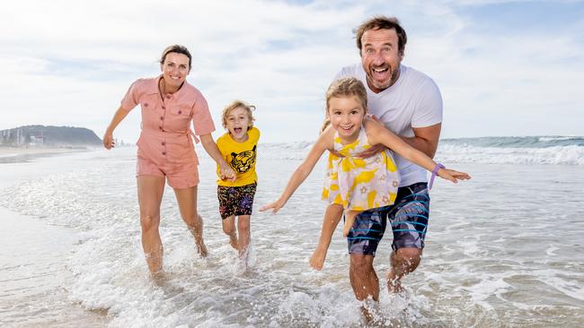 Anthony and Petra Nowak with their children Peter and Mira on the Gold Coast. Picture: Luke Marsden