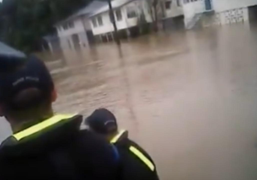 Police Survey Houses Hit by Flooding in Ingham