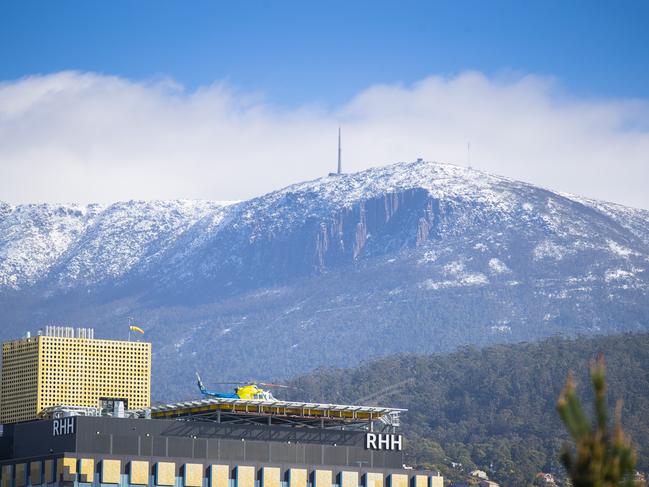 Weather: Snow on Mount Wellington / kunanyi RHH and helicopter pad. Picture: Richard JupeGeneric / file / city / Hobart / cold / winter / war memorial / domain / ambulance / emergency / Royal Hobart Hospital / chopper / rescue