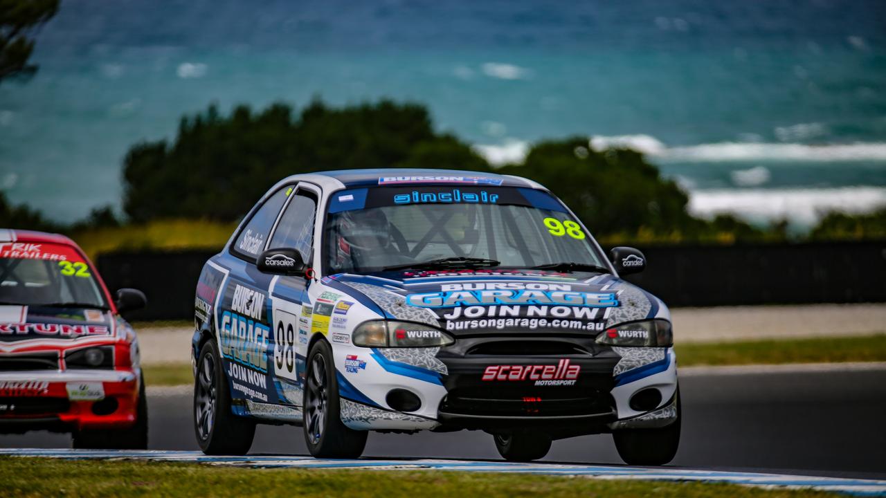 Mike Sinclair takes to the Grand Prix Circuit on Phillip Island in a Hyundai Excel. Image: Revved Photography.