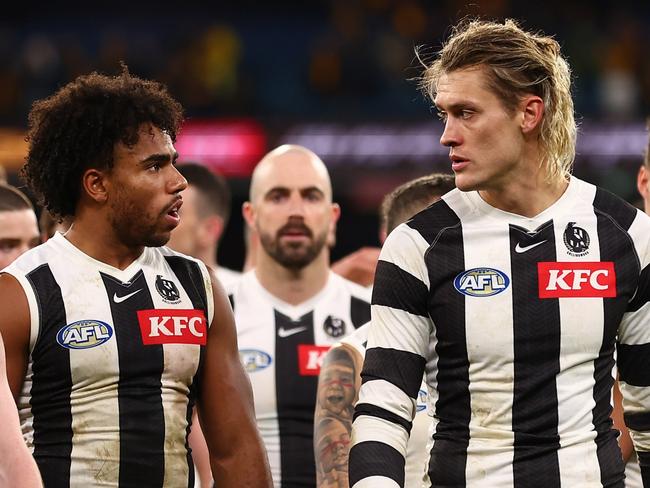 MELBOURNE, AUSTRALIA - JULY 20: The Magpies look dejected following the round 19 AFL match between Hawthorn Hawks and Collingwood Magpies at Melbourne Cricket Ground on July 20, 2024 in Melbourne, Australia. (Photo by Graham Denholm/AFL Photos/via Getty Images)