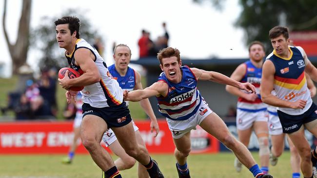 Adelaide’s Darcy Fogarty looks to surge forward against Central District at Elizabeth on Saturday. Picture: Tom Huntley.