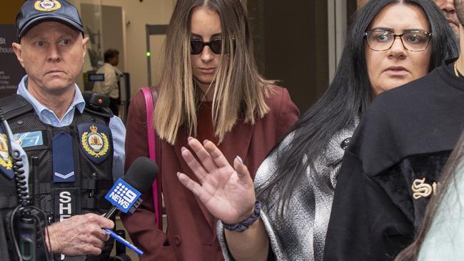 She kept her head down as she left court on Friday after Hayne was taken into custody. Picture: NCA NewsWire/Simon Bullard