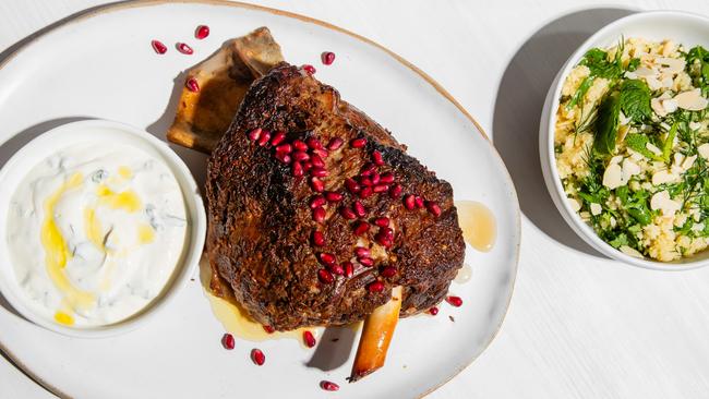 Pomegranate slow-roasted lamb shoulder. Picture: Nikki To