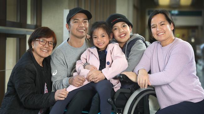 Rhyle Abiado, 11, with his mother Lucila, father Marvin, sister Davie and grandmother Francisca Galunza is almost ready to go home. Picture: Dean Martin