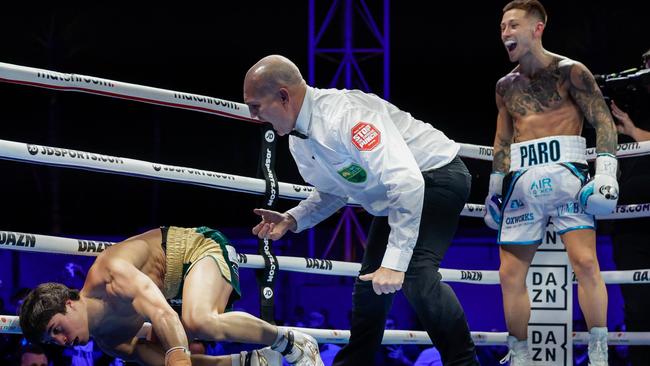 Liam Paro roars his approval as Brock Jarvis struggles to get off the canvas. Picture: Russell Freeman/Getty Images