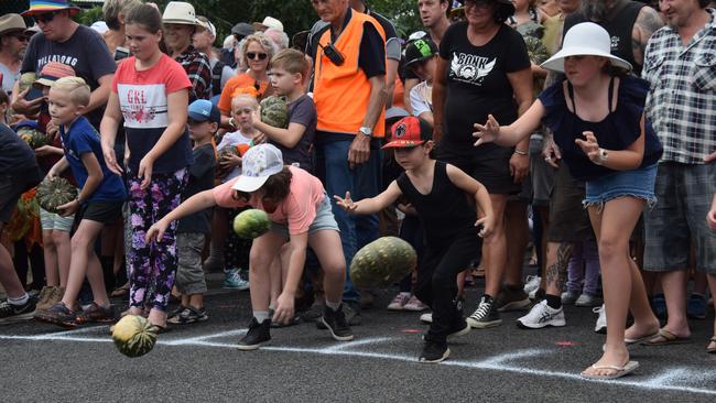 Competitors lining up for the famous pumpkin roll at last year’s Goomeri Pumpkin Festival. Photo: File