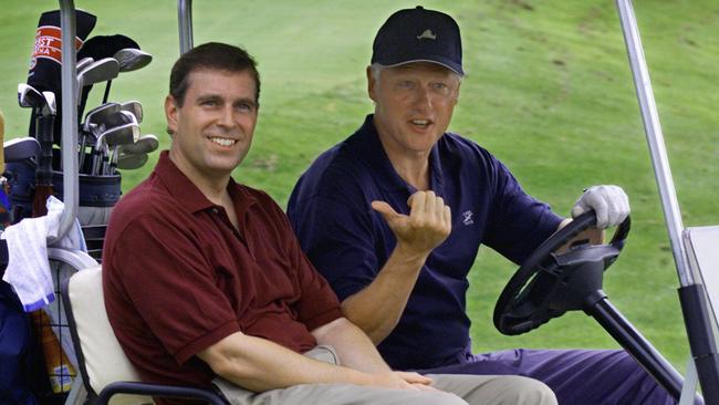 Prince Andrew with President Bill Clinton during a round of golf at Martha's Vineyard in 1999.