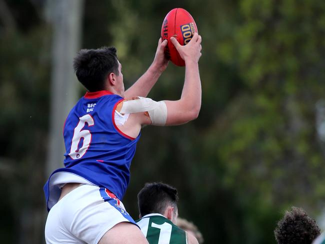 Ben Kellett takes a grab for South Barwon. Picture: Mike Dugdale