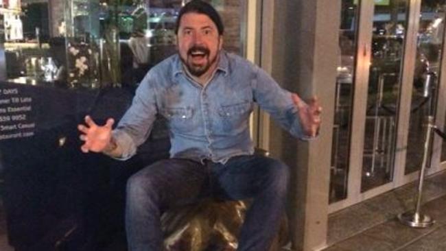 Dave Grohl grabbing the bull by the horns at Moo Moo Bar and Grill last night. Picture: Supplied