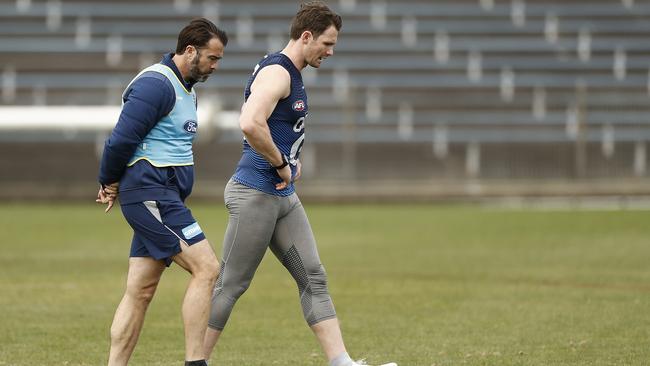 Cats coach Chris Scott speaks with Patrick Dangerfield at a training session at Henson Park in Sydney on Tuesday Picture: Getty Images