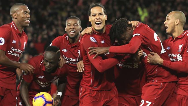Liverpool forward Divock Origi, second from left, celebrates with teammates. Picture: AP