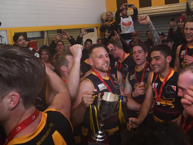 Doncaster East players celebrate in the clubrooms after being victorious in the EFL Div 2 Grand Final.