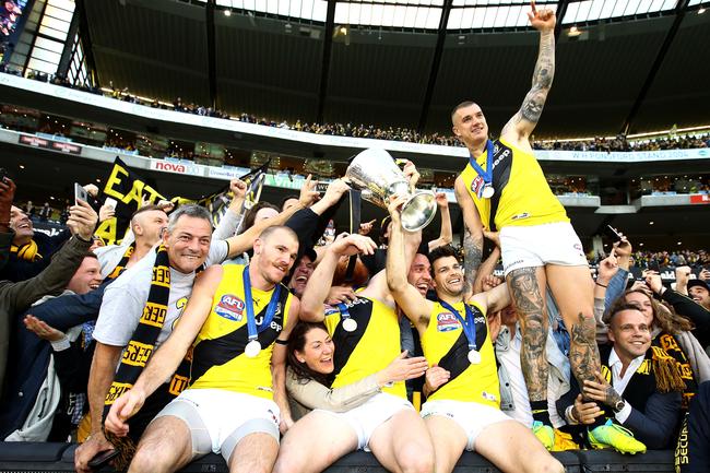 The Tigers players celebrate victory with the cup during the 2017 AFL Grand Final