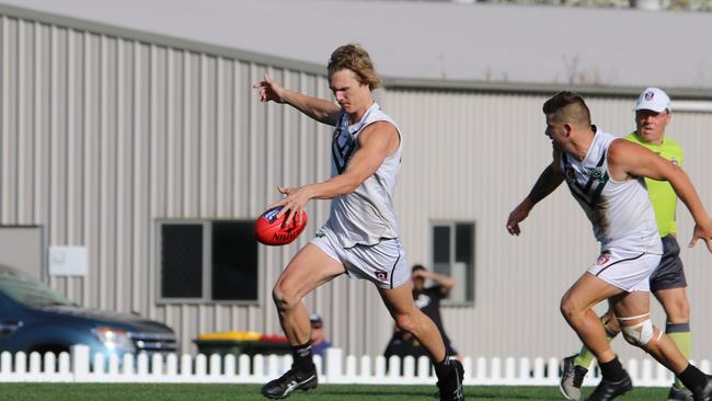 Tom Overington of Park Ridge Pirates kicks long.