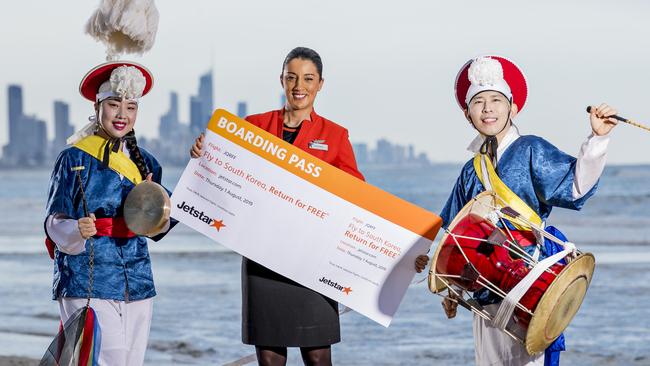 The sale of Jetstar Direct flights to Seoul  from the Gold Coast start on Thursday, with the first flight taking off in December 2019.  Traditional Korean performers Maria McDonnell and Joseph Gyu Tae No and Jetstar cabin crew member Simonette Haddad, Picture: Jerad Williams