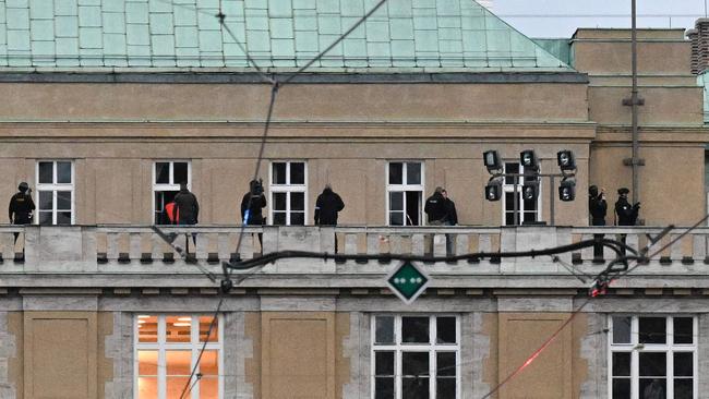 Armed police are seen on the balcony of the Charles University in central Prague. Picture: AFP