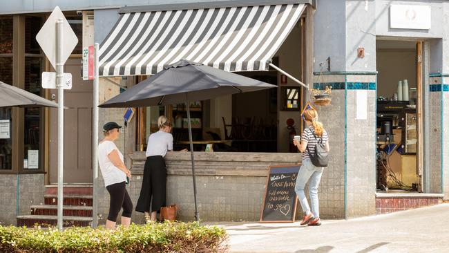 People line up to get takeaway coffee and lunch from The Little Marionette Cafe, Annandale, NSW. Picture: Adrian Fowler/ NEWS360