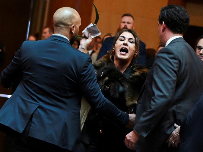 Australian Senator Lidia Thorpe stages a protest as Britain's King Charles and Queen Camilla attend a Parliamentary reception in Canberra, Australia - 21 Oct 2024. Victoria Jones/Pool via REUTERS TPX IMAGES OF THE DAY