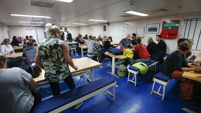 Evacuees gather in the mass hall. Picture: David Caird