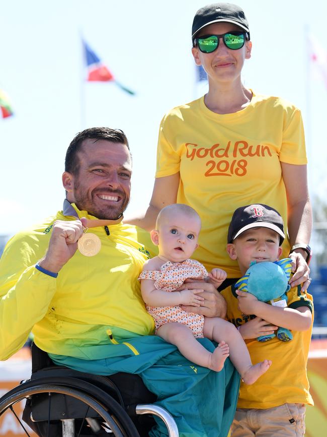 Fearnely with wife Sheridan and children Harry and baby Emilia at the Commonwealth Games in April. Picture: AAP