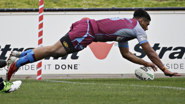 Joshua Mocevakaca scores a try for \Hills Sports High school. Picture: Adam Yip