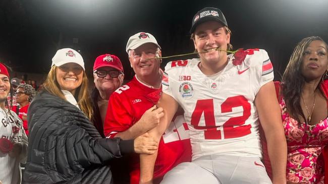 Joe McGuire with his parents Carla and Eddie at the Rose Bowl