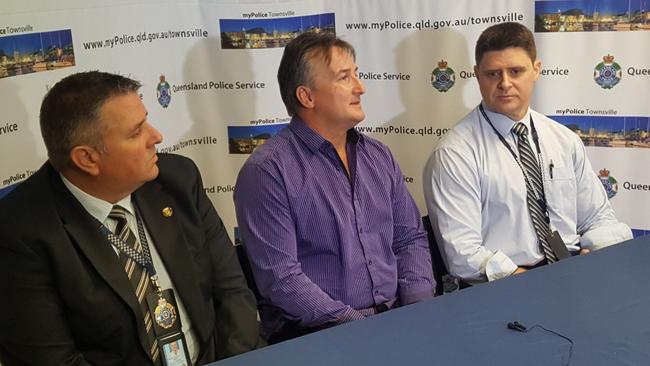 Dorothy Britton's son Adrian (centre), flanked by Homicide Investigation Unit Detective Senior Constable Darren Mills (L) and Townsville Crime Services Group Detective Acting Inspector Phil Watts, during the press conference. Pic: Scott Sawyer