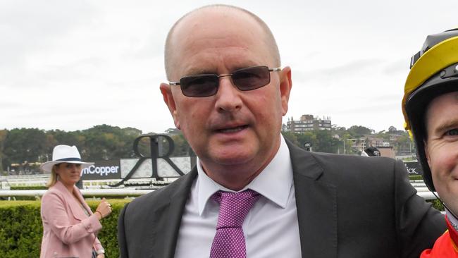 Jockey Tommy Berryis seen in the mounting yard with trainer Toby Edmonds after riding Winter Bride to victory in race 1, the Wenona Girl Quality during Randwick Guineas Day at Royal Randwick Racecourse in Sydney, Saturday, March 9, 2019. (AAP Image/Simon Bullard) NO ARCHIVING, EDITORIAL USE ONLY