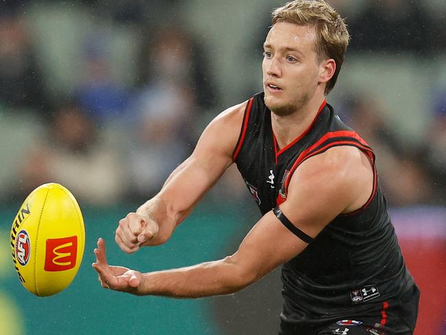 Darcy Parish tried to battle through a corkie, but was forced out. Picture: AFL Photos/Getty Images