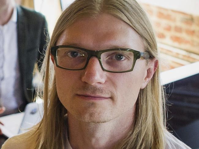 Jesse Powell, chief executive officer of Kraken Bitcoin Exchange, sits for a photograph at the company's office in San Francisco, California, U.S., on Friday, Aug. 8, 2014. Kraken Bitcoin Exchange is planning a Japanese-language website for bitcoin-yen trading, Powell said in an interview with Kyodo News in March. The exchange currently accepts dollars, euro and the Korean won. Photographer: David Paul Morris/Bloomberg via Getty Images