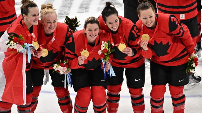 Canadian players celebrate after winning gold in ice hockey. Picture: AFP