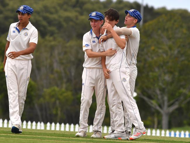 St Joseph's Nudgee College bowler Tom Malone gets the team congratulations after the break through wicket.GPS First XI cricket match between Brisbane Grammar School and St Joseph's Nudgee College.Saturday March 6, 2021. Picture, John Gass