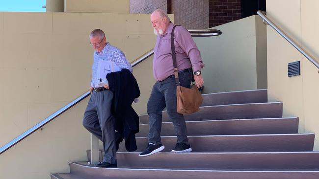 Brian Peter Rogers (right) leaves court after pleading guilty to possessing child exploitation material. Photo: Elyse Wurm