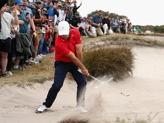 Patrick Reed plays a shot on the sixth hole during his singles win on Sunday.