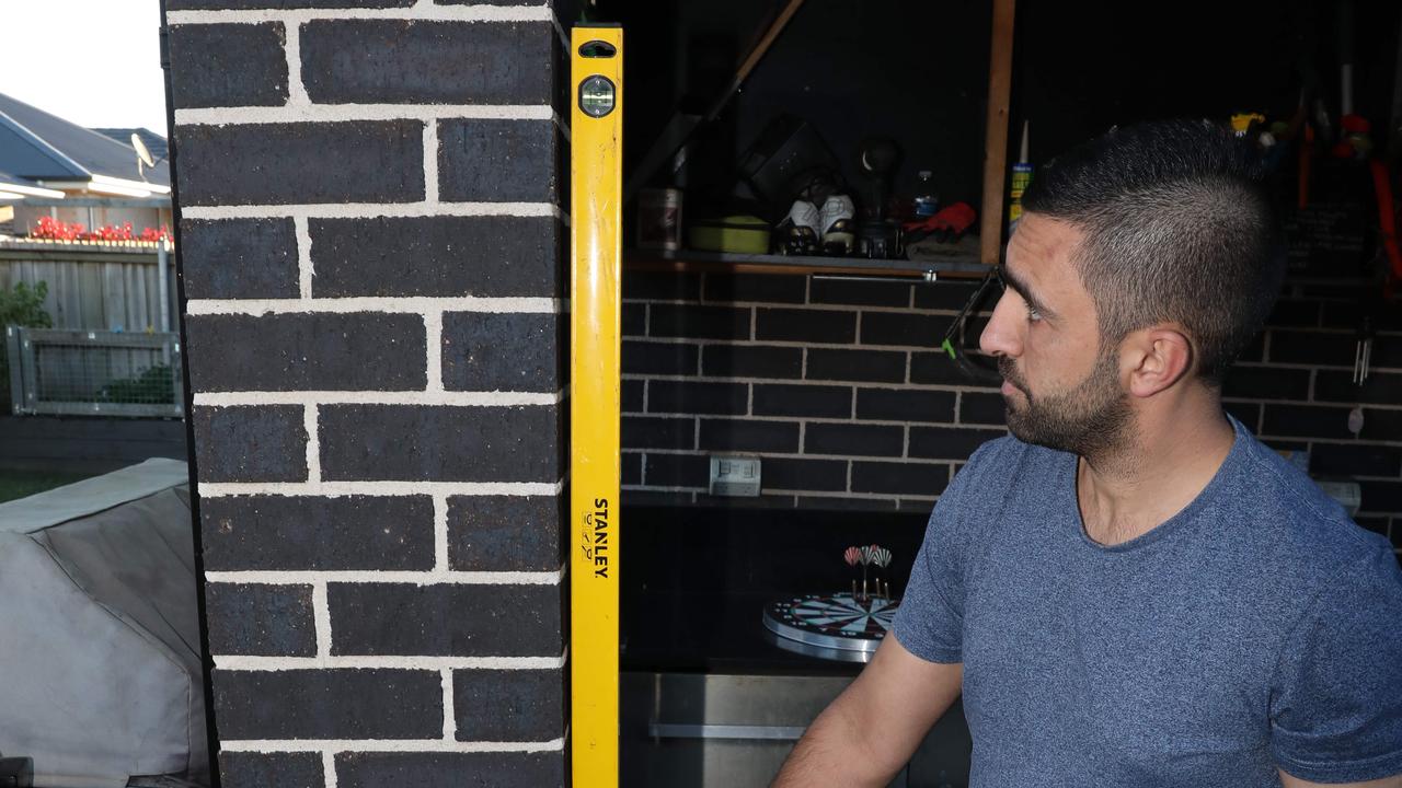 Danny Moussa, in 2021, showing the damage to his home in Spring Farm. Picture: Damian Shaw