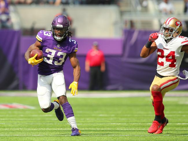 Dalvin Cook carries the ball while pursued by K'Waun Williams. Picture: Getty