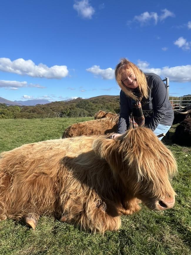 Kate Kulas with a Highland cow.