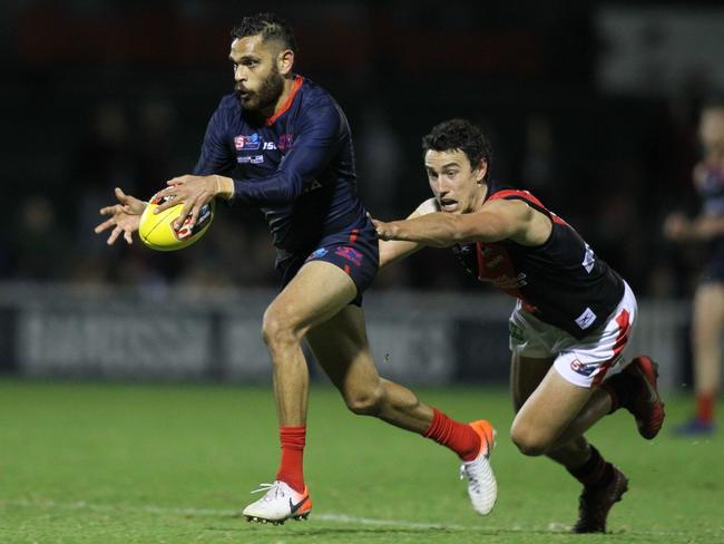 SANFL: Norwood v West Adelaide at Norwood Oval. Norwood's Dominic Barry escapes a lunging Thomas Keough for West. 31 May 2019. Picture Dean Martin